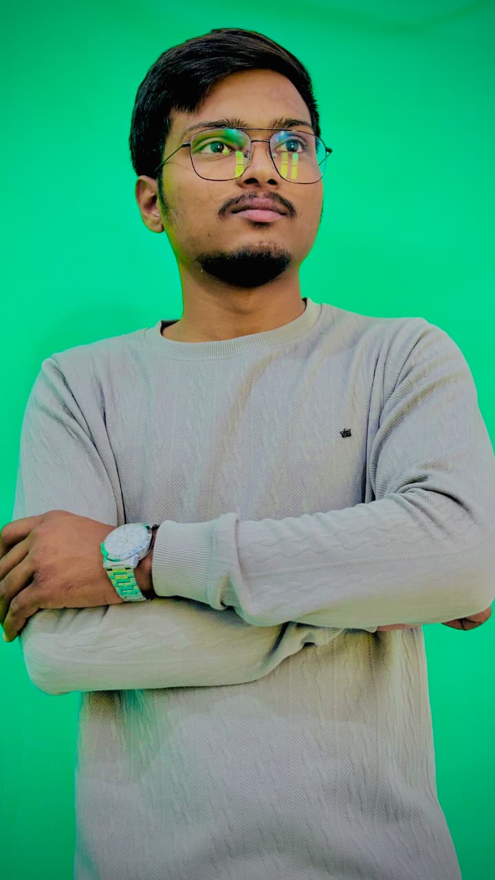 Jayendrasinh Parmar wearing glasses, with arms folded